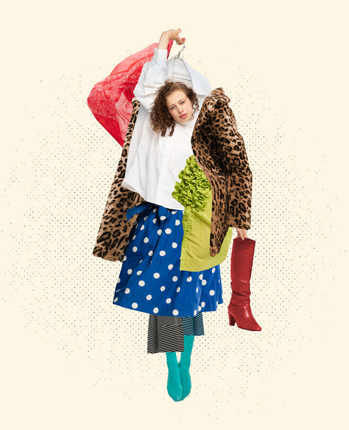 Crazy shopping. Creative art portrait of fashionable woman wearing a lot of diverse clothes over white background. Beauty, fashion, style, shopping addiction and black Friday concept. - Photo, image