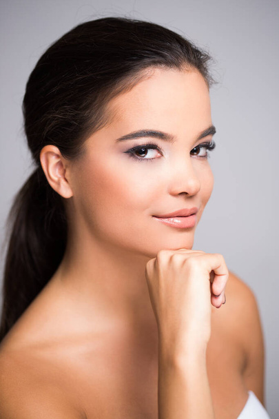 Beautiful ethnic young brunette woman in natural makeup. - 写真・画像