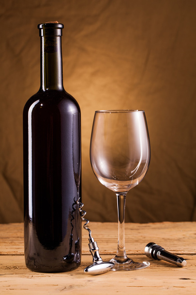 Wine bottle and corkscrew - Fotó, kép