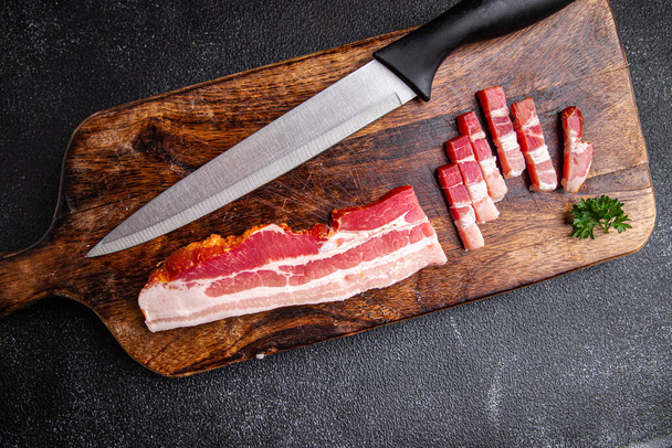 slice bacon pork strips lard smoked meat meal food snack on the table copy space food background - Fotoğraf, Görsel