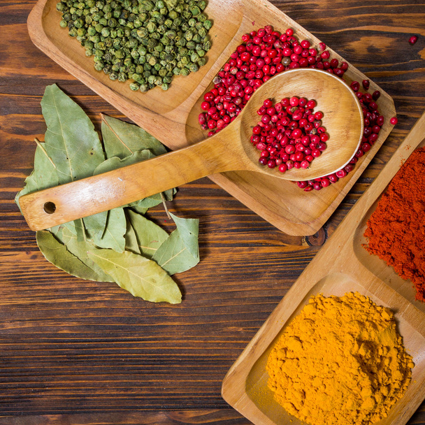 Colorful herbs,spices and aromatic ingredients  on wooden table. - Photo, Image