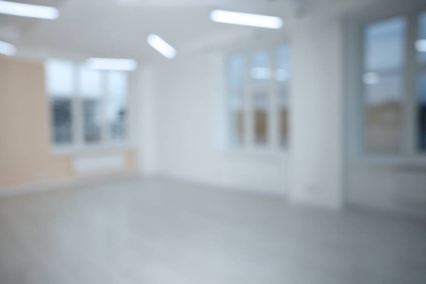 Blurred view of empty room with windows and light walls - Photo, image