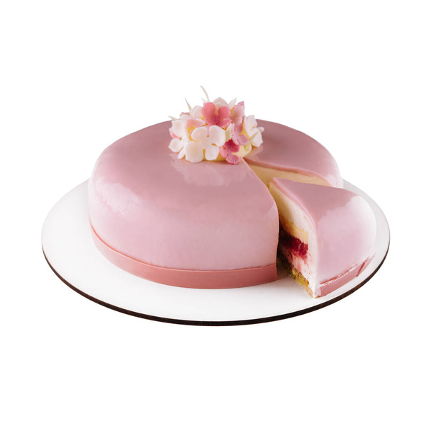 Pink mousse cake with mirror glaze decorated with flowers - Photo, image