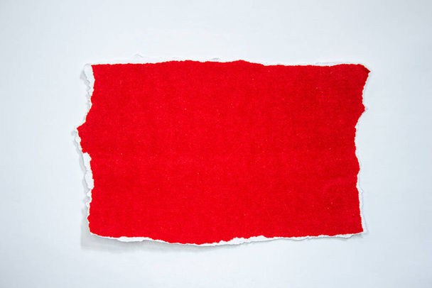 Red torn paper isolated on white background. Ripped paper with copy space. - Fotografie, Obrázek
