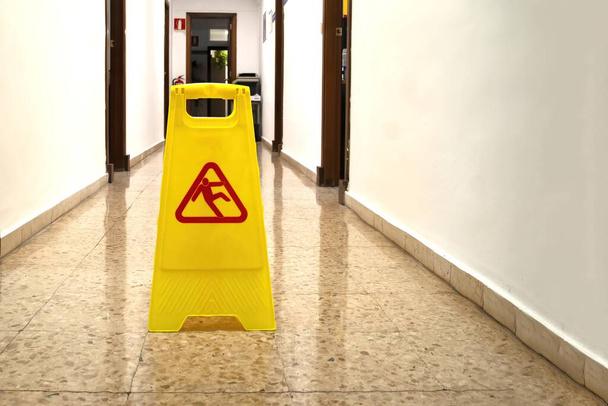 A yellow slippery wet floor sign - Photo, Image