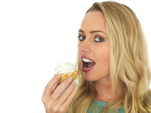 Young Woman Eating Mince Pie with Cream - Photo, Image