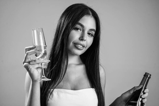 sexy woman drinking champagne from glass, birthday. - Photo, image