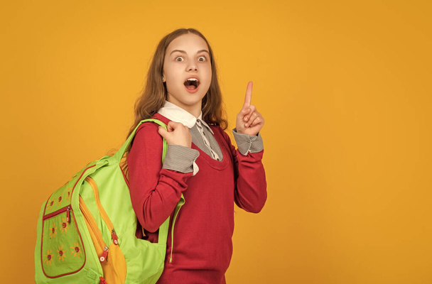 back to school. knowledge day. concept of education. kid on yellow background. september 1. happy childhood. child with school bag. copy space. inspired with idea teen girl carry backpack. - Foto, Bild