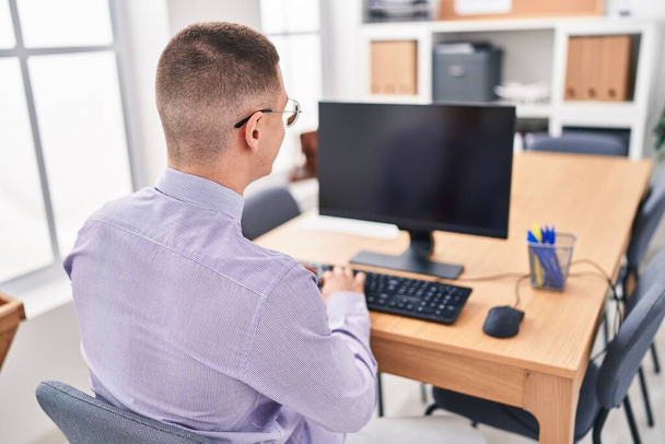 Young hispanic man business worker using computer working at office - Φωτογραφία, εικόνα