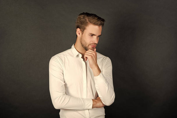 young man in white shirt on black background, fashion. - Fotografie, Obrázek