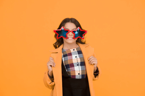 Rock star. Feeling like a superstar. Girl confident cool kid wear star shaped sunglasses. Star concept. Fame and popularity. Party holiday celebration. Cheerful girl wear eyeglasses for fun. - Photo, image