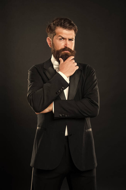 brutal gentleman in tuxedo on black background, menswear. - Fotoğraf, Görsel