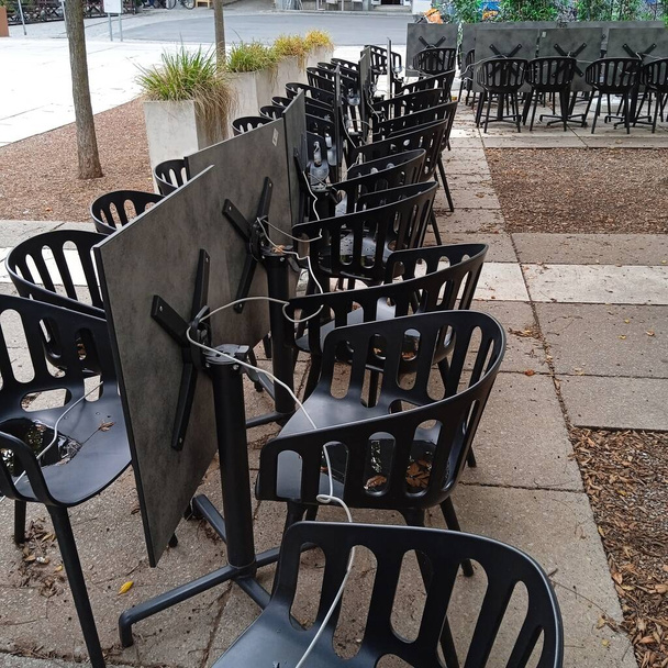 empty beer garden or schanigarten, sidewalk seating and gastronomy in summer - Photo, Image