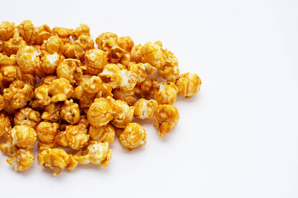 Honey caramel popcorn on white background. - Foto, Imagem