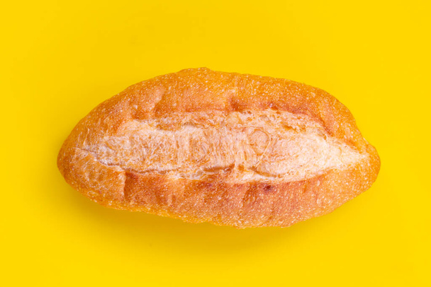 Bread isolated on yellow background - Foto, Imagem