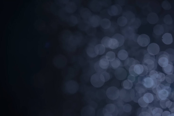 A dark blue background bokeh image for used to decorate background. - Foto, afbeelding