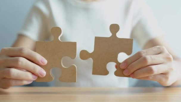 Hand connecting couple puzzle piece. Business Solving, mission, challenge, success, goals, target and strategy concepts - Footage, Video
