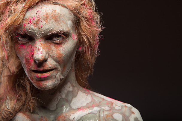Woman covered in healing clay - Фото, изображение