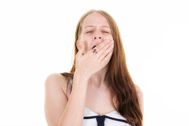 businesswoman in dress suit tie yawns hand over mouth - Photo, Image