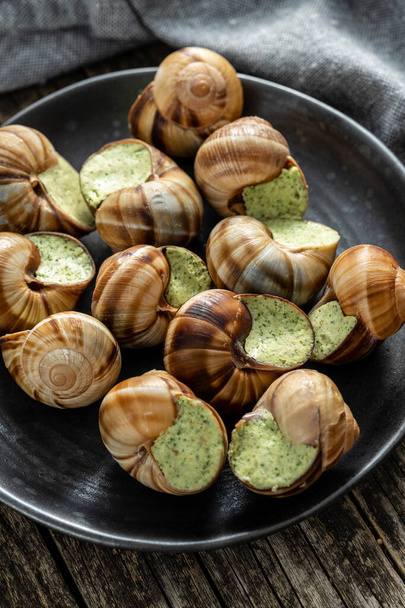 Snails with parsley butter, Bourgogne Escargot Snails on the plate. Delikatese food. - Fotoğraf, Görsel