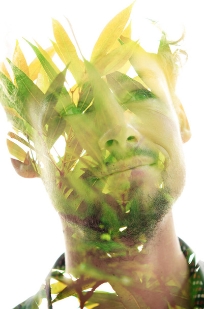 Tropical double exposure portrait of a young man - Photo, Image