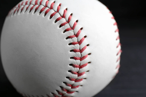 Baseball ball on black background, closeup. Sports game - Fotografie, Obrázek