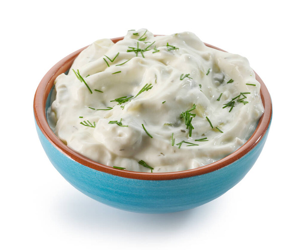 bowl of tzatziki sauce isolated on white background - 写真・画像