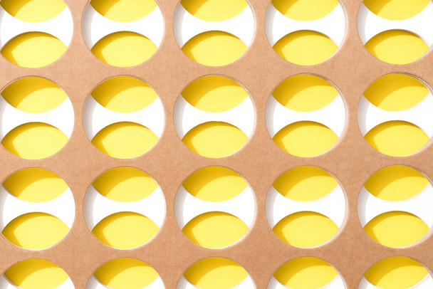 Creative open composition - paper art abstract geometric background. Brown and white circles above yellow background. Minimal style pattern. Copy space for text - 写真・画像