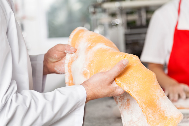 Midsection Of Chef Holding Ravioli Pasta Sheet At Kitchen - Photo, Image