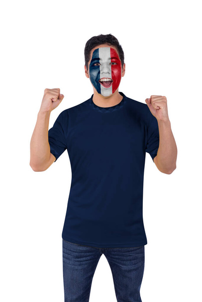 Young sports and soccer fanatic man with blue France jersey happy shouting with emotion for the victory of his favorite team. - Фото, зображення