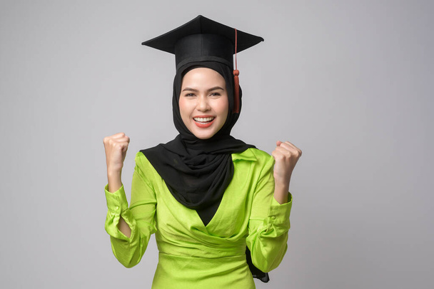 A Young smiling muslim woman with hijab wearing graduation hat, education and university concept	 - Foto, Imagem