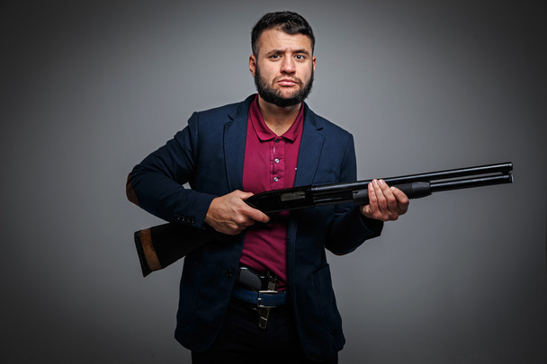 Powerful businessman with a gun - Zdjęcie, obraz