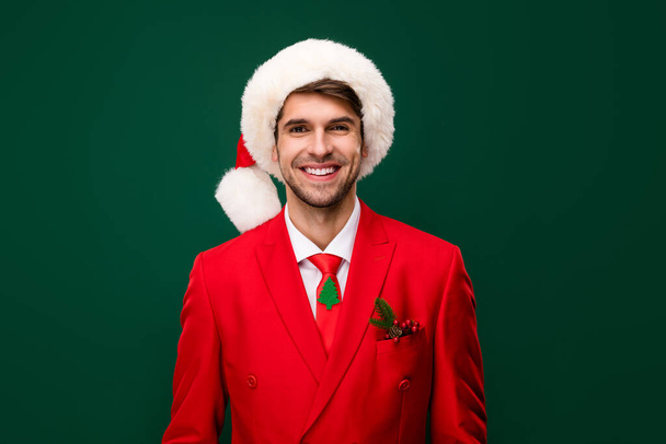 Portrait of attractive classy chic cheerful guy wearing festal decorated look cap isolated over green color background. - Φωτογραφία, εικόνα