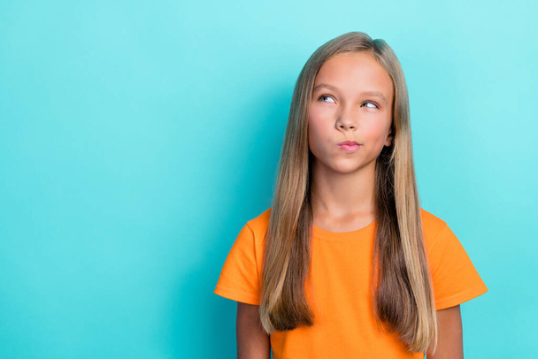 Close up photo of minded girl wear orange trendy clothes interested look empty space creative decision isolated on cyan color background. - Fotografie, Obrázek