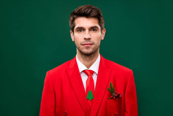 Photo of attractive charming santa claus guy wear red suit smiling isolated green color background. - Foto, Imagen