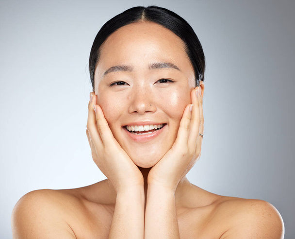 Cosmetics, asian woman and facial care for natural beauty, wellness and smile being happy, studio background and healthy. Portrait, makeup and organic facial for skincare, health and relax body care - Photo, image