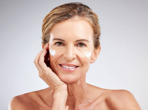Skincare, anti aging cream and senior woman with luxury cosmetics product for beauty, wellness or self care. Happy, smile and face portrait of elderly person with natural spa lotion or facial makeup. - Photo, Image