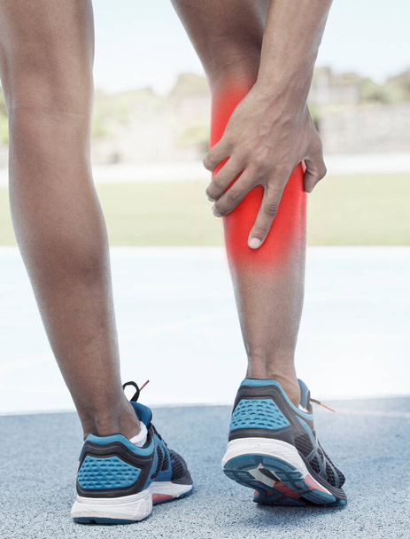 Runner, calf pain and leg injury accident during fitness running exercise in athletic shoes outside. Sports man, muscle strain and calf during marathon cardio training workout on track field. - Photo, image