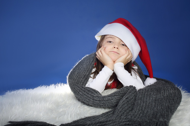 Bored young girl in Santa's hat - Foto, imagen