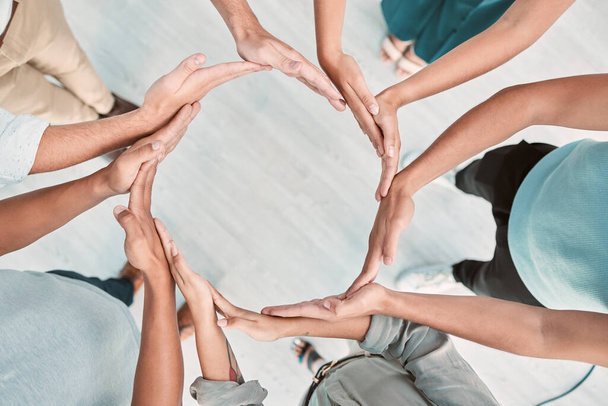 Team building, support and business people with hands in a circle for partnership, collaboration and teamwork at work. Corporate workers with a mission, community or solidarity for trust from above. - Foto, Imagem