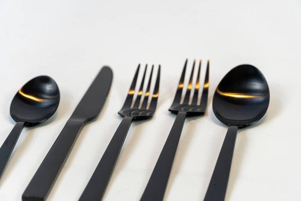 black metal forks and spoons on a white background, mexico latin america - Zdjęcie, obraz