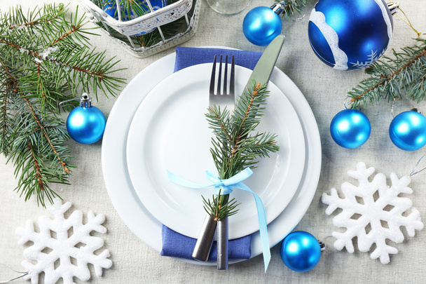 Stylish blue and white Christmas table setting on grey tablecloth background - Fotoğraf, Görsel