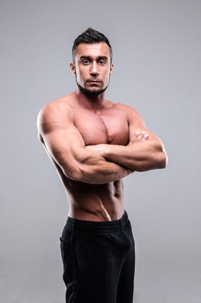 Handsome muscular man isolated - 写真・画像