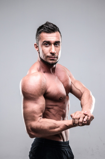 Handsome muscular man isolated - Photo, Image
