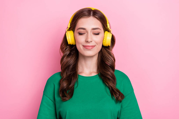 Close up photo satisfied pretty nice lady wear stylish green clothes listening favorite track isolated on pink color background. - Φωτογραφία, εικόνα