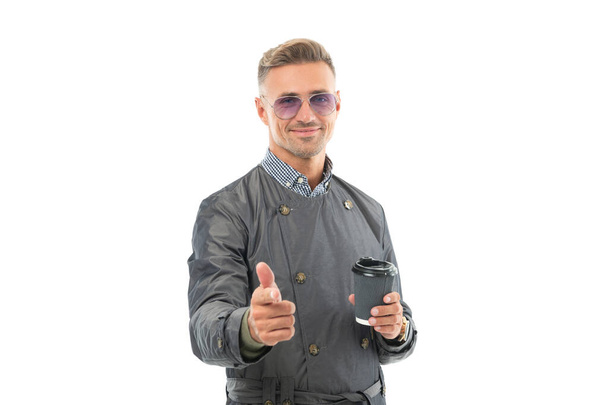 Happy smiling business man businessman boss in coat making finger gun gesture holding coffee cup studio isolated on white, coffee. - Foto, Imagem