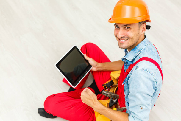 Construction Worker with a tablet. Planning Developer Concept. - 写真・画像