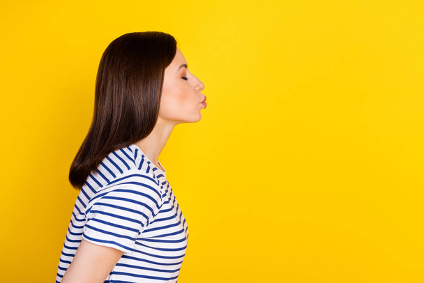 Profile side view photo of sweet gentle lady eyes closed imagine boyfriend send kiss isolated on yellow color background. - Fotoğraf, Görsel