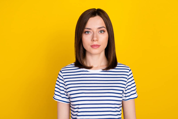 Photo of young gorgeous adorable girl with bob hairstyle dressed striped t-shirt looking at camera isolated on yellow color background. - Foto, immagini