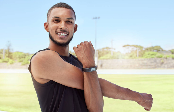 Fitness, athlete stretching and black man happy about exercise, runner workout and sports. Portrait of sport runner stretching with a smile for training, running and strong health cardio outdoor. - Fotoğraf, Görsel